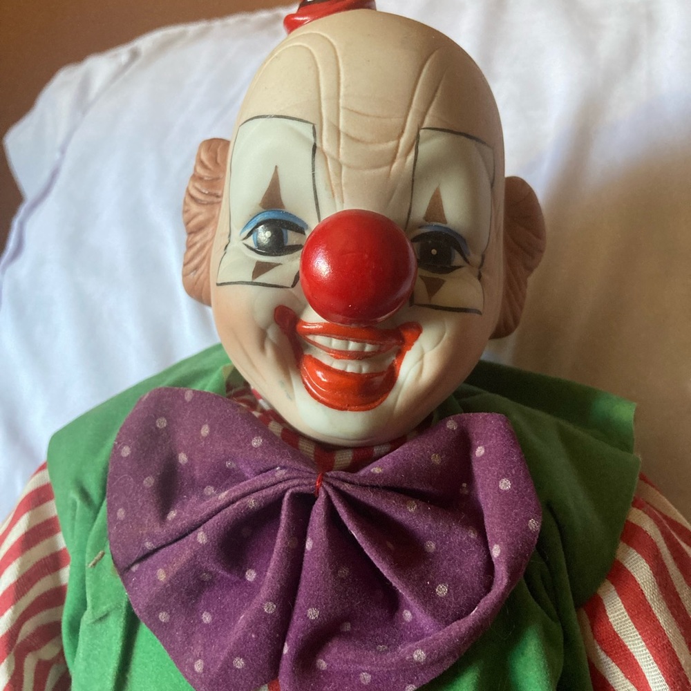 Clown doll.  17” x 7”.  Porcelain head.  No brand name
